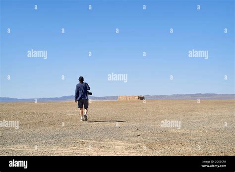 Man Walking On Desert Road Hi Res Stock Photography And Images Alamy