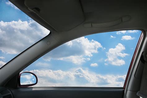 View Of Sky Through Window From Inside Car Stock Photo Download Image