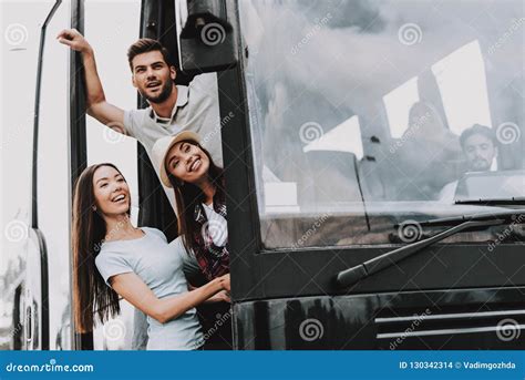 Young Smiling People Traveling On Tourist Bus Stock Photo Image Of