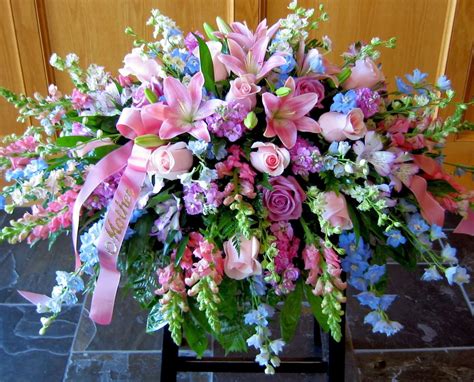 Placing your funeral flower arrangements order online. feminine shades | Funeral flower arrangements, Casket ...