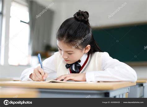 Little Girl Writing Desk Classroom Stock Photo By ©tuchong Microstock1