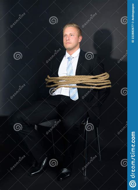 Young Businessman Tied With Rope To A Chair Stock Image Image Of