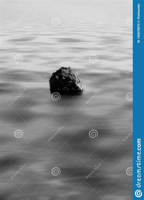 The Black Rock In The Ocean Stock Photo Image Of Exposure Lone