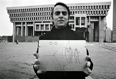 Carl Sagan Holding One Of The Two Pioneer Plaques He Helped Design With