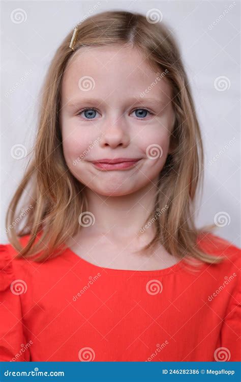 Portrait Of Blonde Beautiful Little Girl With Blue Eyes Stock Photo