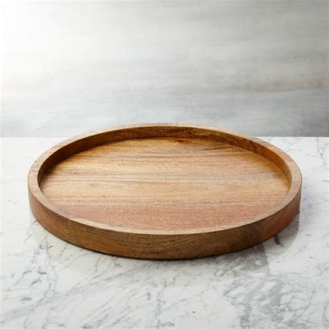 While they may be small things, it's those details that make a little space speak volumes. Wood Round Serving Tray | Crate and Barrel