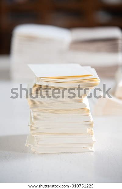 Closeup Of Stacked White Papers On Table In Factory