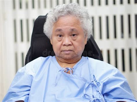Asian Senior Or Elderly Old Lady Woman Patient Smile Bright Face While Sitting On Wheelchair In