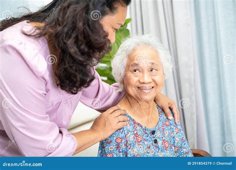 Caregiver Help and Support Asian Senior Woman with Love and Care in