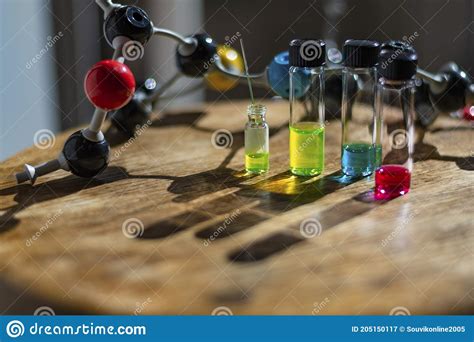 Colourful Solutions In Glass Vials Under The Light With Molecule Model