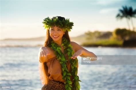 Portrait Of Hawaiian Hula Dancer Dancing On The Beach High Res Stock