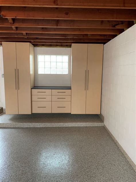 Elegant light colored wooden cabinets in garage is a great idea for those planning to make their garage look beautiful and well organized. Milwaukee Garage Cabinet Ideas Gallery | White Rabbit