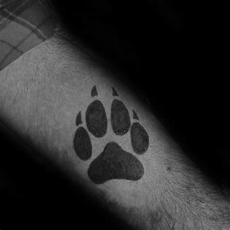 Small Simple Wolf Paw Forearm Solid Black Ink Tattoo On Guy Wolf
