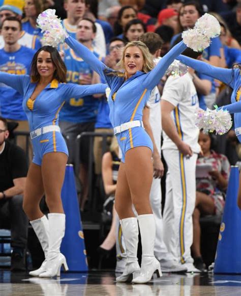 Cheerleaders Perform During A Basketball Game