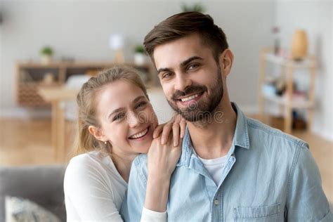 Head Shot Portrait Of Happy Smiling Husband And Wife At Home Stock