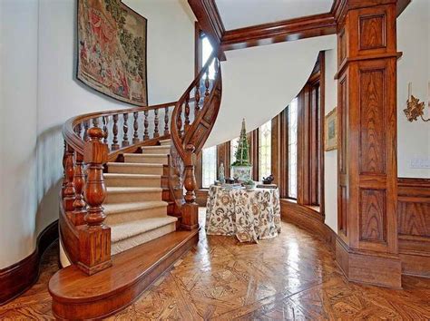 A grand foyer and large great room make this home open and welcoming. inside victorian homes pictures with fancy ladder ...