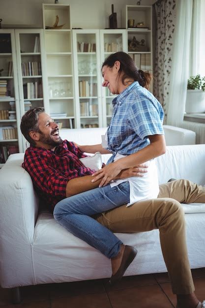 Premium Photo Happy Woman Sitting On Mans Lap In Living Room