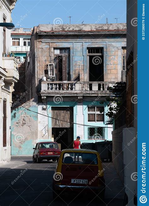 Havana Street With A Building With Balconies And A Deteriorated Facade
