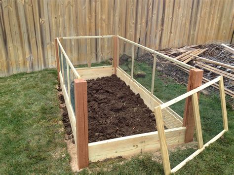 The heavy bolts on the wood give this design an. Raised Bed with Removable fence Panels... http ...