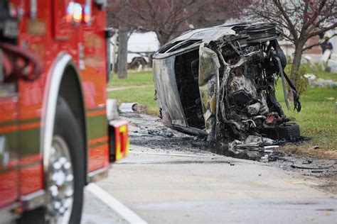 Bystanders step in, rescue person from vehicle on fire after crash in