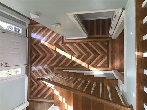 Foyer With Unique Herringbone Pattern Flooring Carpet Hardwood