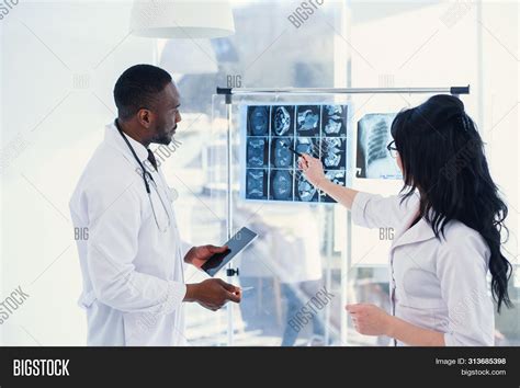 Two Doctors Look X Ray Image And Photo Free Trial Bigstock