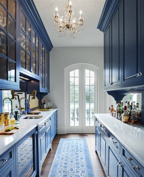 Butlers Pantry With Blue Cabinetry In A French Country Style House