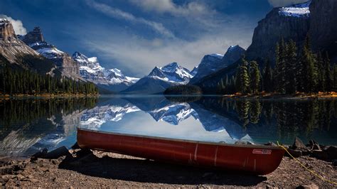 Reflection Of Mountain On Lake Water And A Boat On Shore Hd Nature