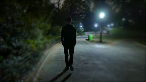 A walk in the park. Man Walking Alone at Night Stock Footage Video (100% ...