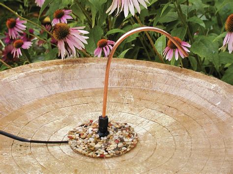 To provide a better footing, line your bath basin with large stones or pea gravel to make birds feel less vulnerable. Bird bath dripper, Bird bath, Backyard birds