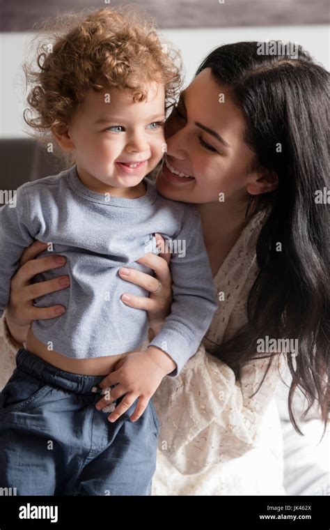 Caucasian Mother Hugging Son Stock Photo Alamy