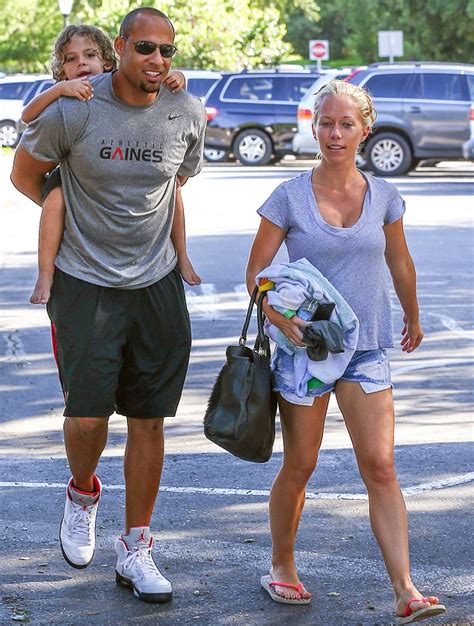 kendra wilkinson and husband hank baskett dote on son as they enjoy a day out at the swimming