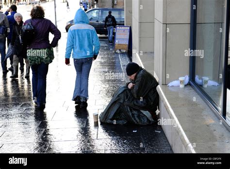 Homeless Man Shivers In Rain While Begging In Edinburgh Scotland Stock Photo Alamy