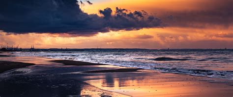 Download Wallpaper 2560x1080 Sea Beach Sunset Dusk Water