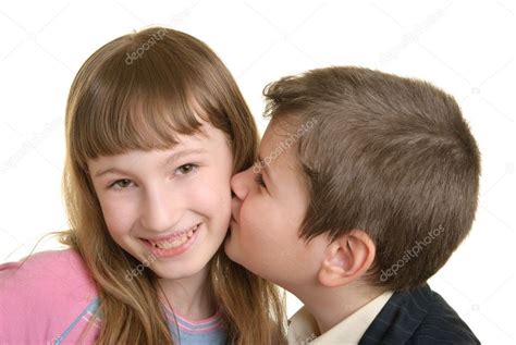 Boy Kisses The Girl On Cheek Stock Photo By ©zametalov 2856588