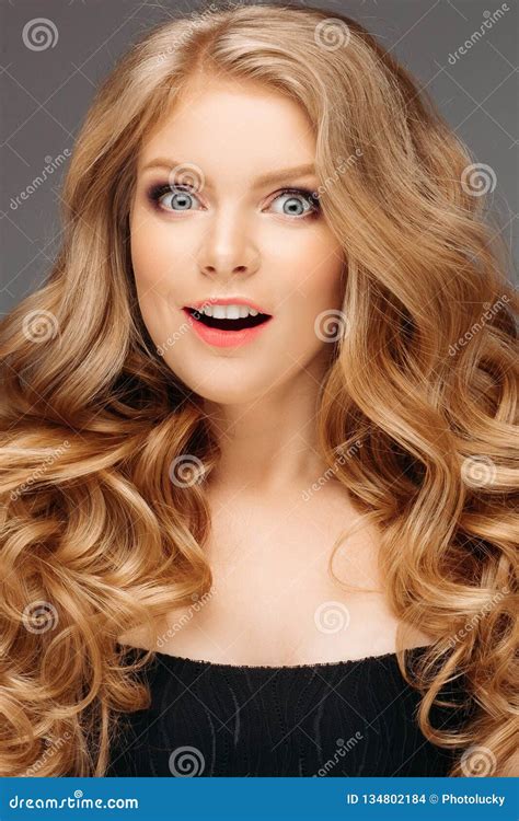 Laughing Blonde Girl With Long And Shiny Wavy Hair Beautiful Smiling