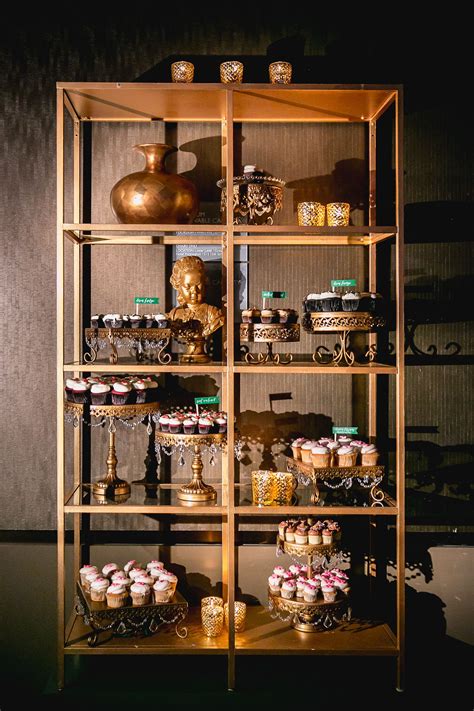 Try cupcakesfilled with jams, caramel, nutella, whipped cream, and more! Gold Cupcake Display Case | Cupcake display, Display case ...