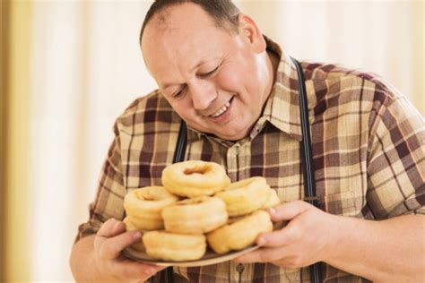 Fat Guy Eating Donuts Pictures Images And Stock Photos Istock