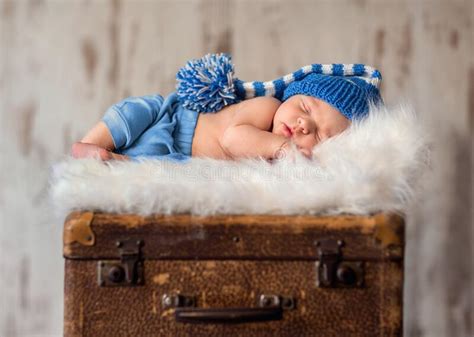 Newborn Baby Is Sleeping On A White Fur Blanket Stock Photo Image Of