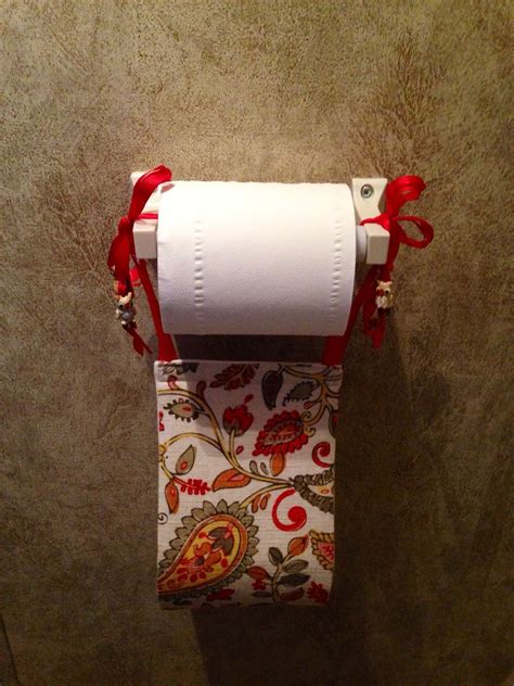 Dispenses toilet paper as it is were dispensing a picture. Decorative toilet paper holder for the extra roll in our ...