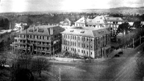 an old black and white photo of buildings