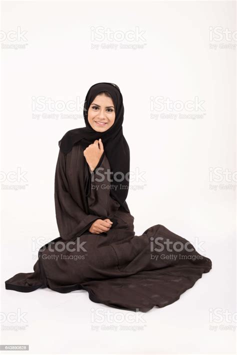 Young Pretty Arab Girl In Traditional Dress Setting On The Floor Stock