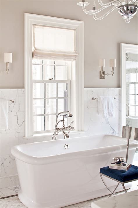 Make the most of your storage space and create an. new york white marble bathroom traditional with tile ...