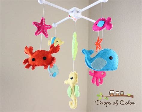 Unlike toys r us and kids r us, this contained 9 characters: Baby Crib Mobile Baby Mobile Nursery Crib by dropsofcolorshop