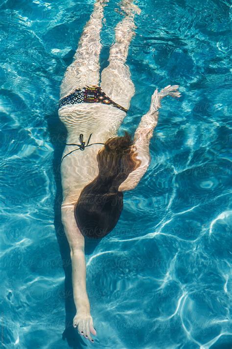 Woman Swimming In Pool By Stocksy Contributor Rzcreative Stocksy