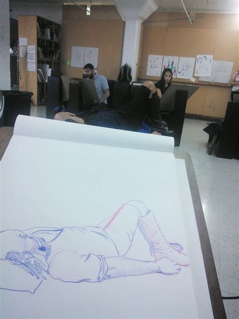 A Mom With Brushes Laying Down Poses 20 Minutes Drawing