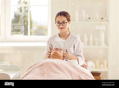 Portrait Of Female Cosmetologist Doctor Doing Massage And Beauty Treatments In Beauty Salon