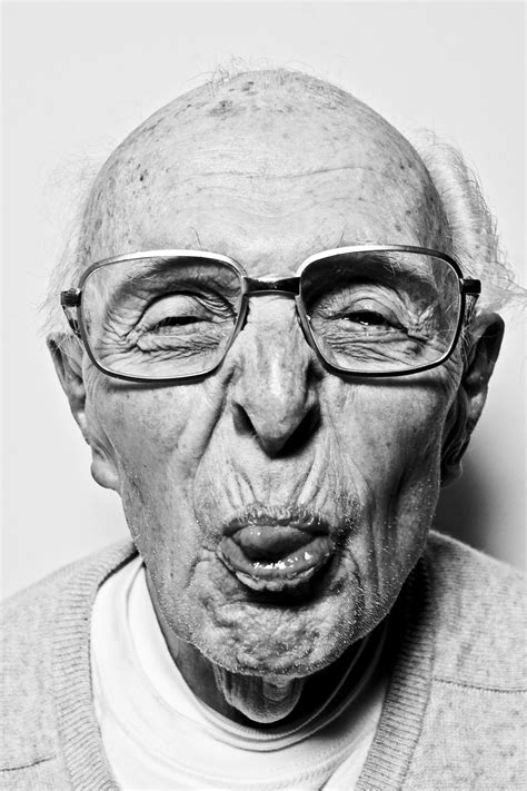 an old man with glasses making a funny face