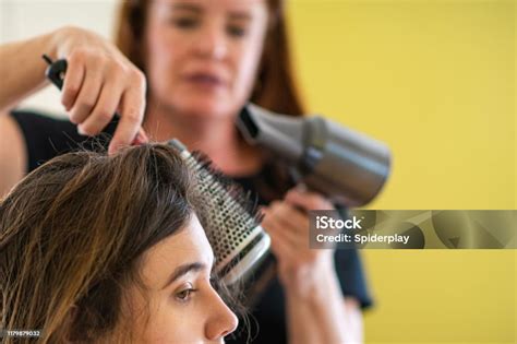 Hairdresser Blowdrying Her Clients Hair Stock Photo Download Image