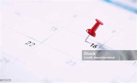 White Calendar With Red Push Pin To Remind An Important Date Stock
